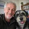 Ray M. with his dog, verified customer